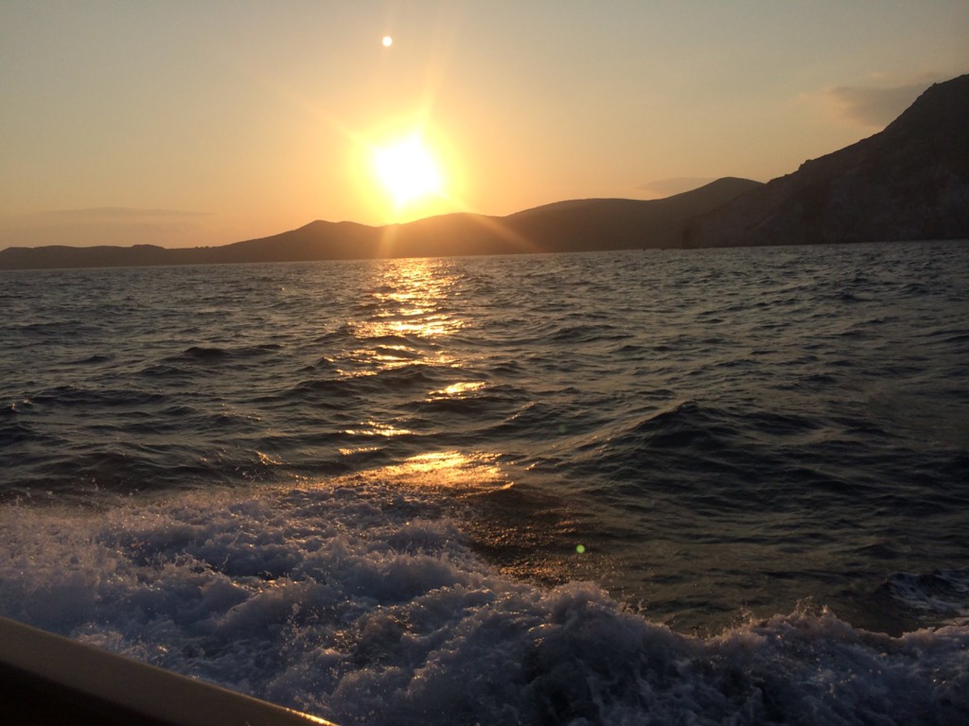 A sailing boat crossing the Aegean toward the Greek islands