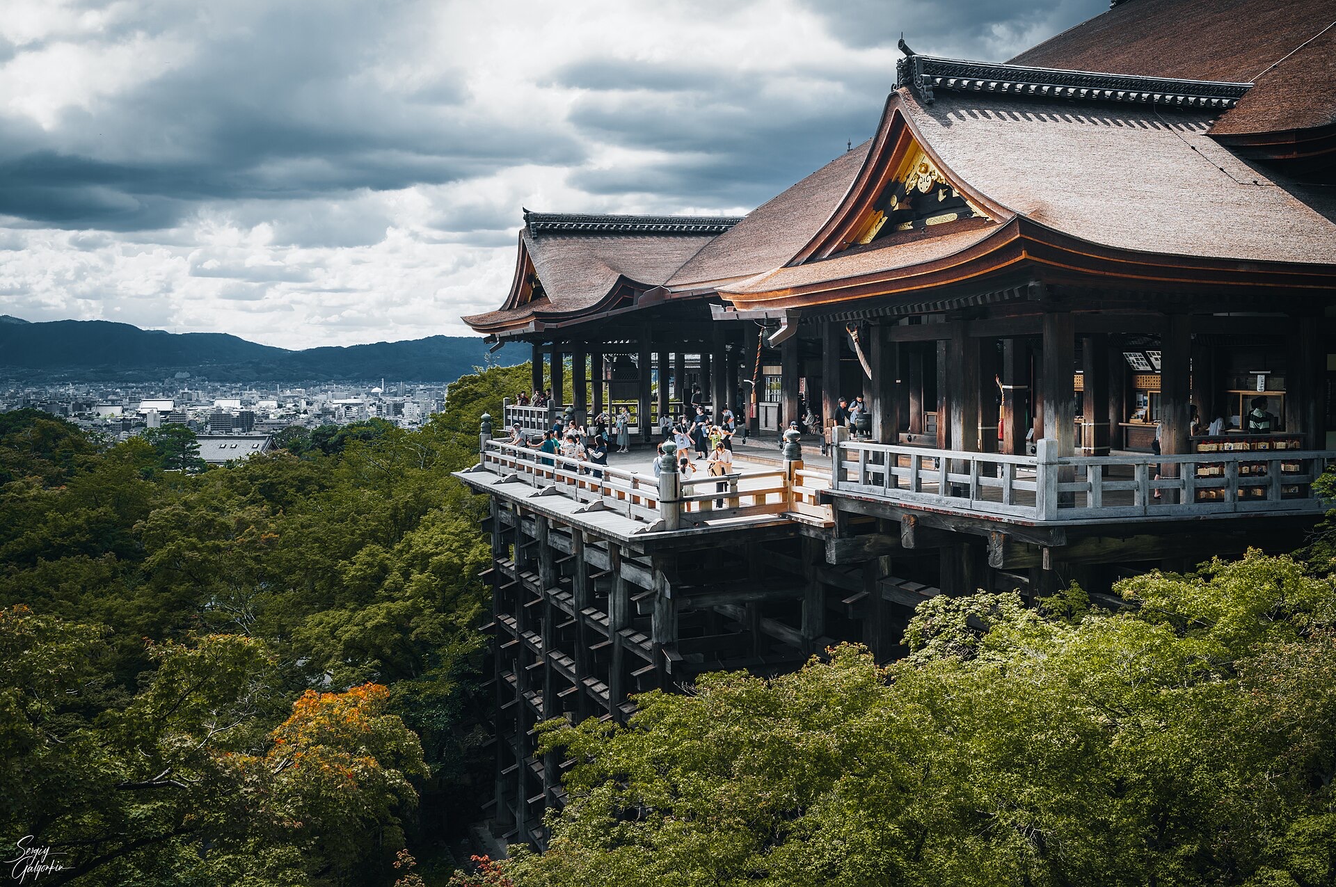 Autumn maples framing a Kyoto temple pagoda