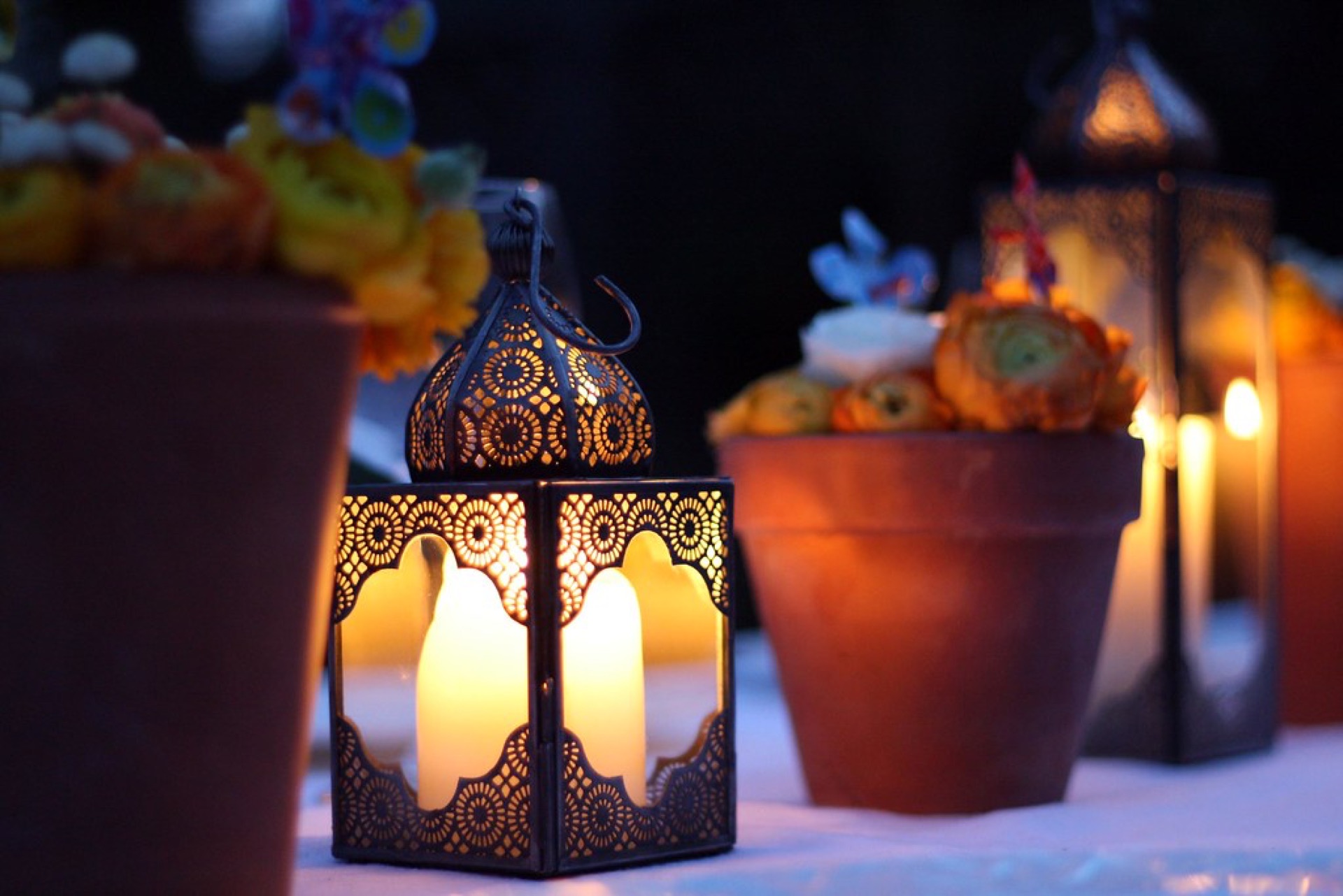 Hand-pierced Moroccan lanterns glowing in a Marrakech atelier